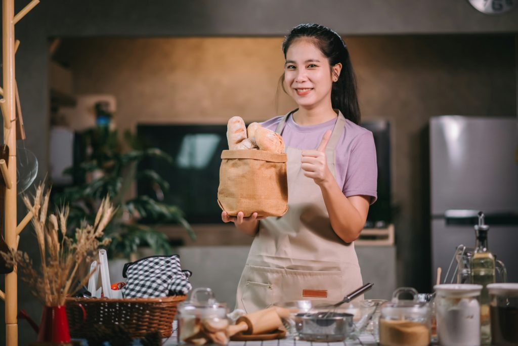 Happy asian woman holding homemade bakery , SME Small business concept